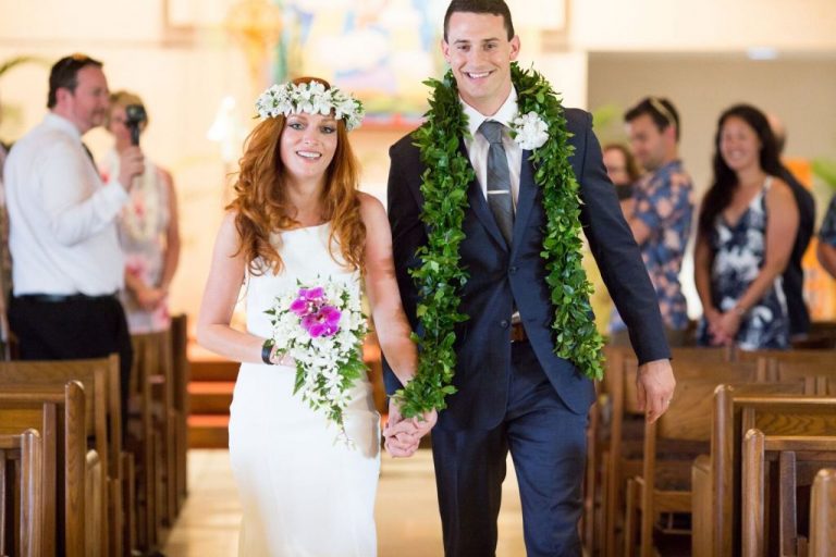 bride and groom with leis